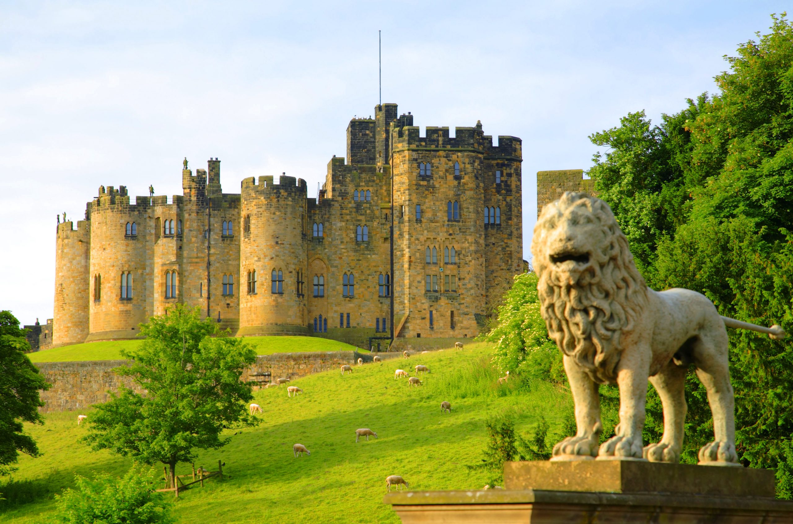 Alnwick Castle viewed from Lion Bridge. Alnwick Castle is a majestic medieval fortress dating from the 11th century and dominates the surrounding Northumberland landscape. It is the second largest occupied castle in England.