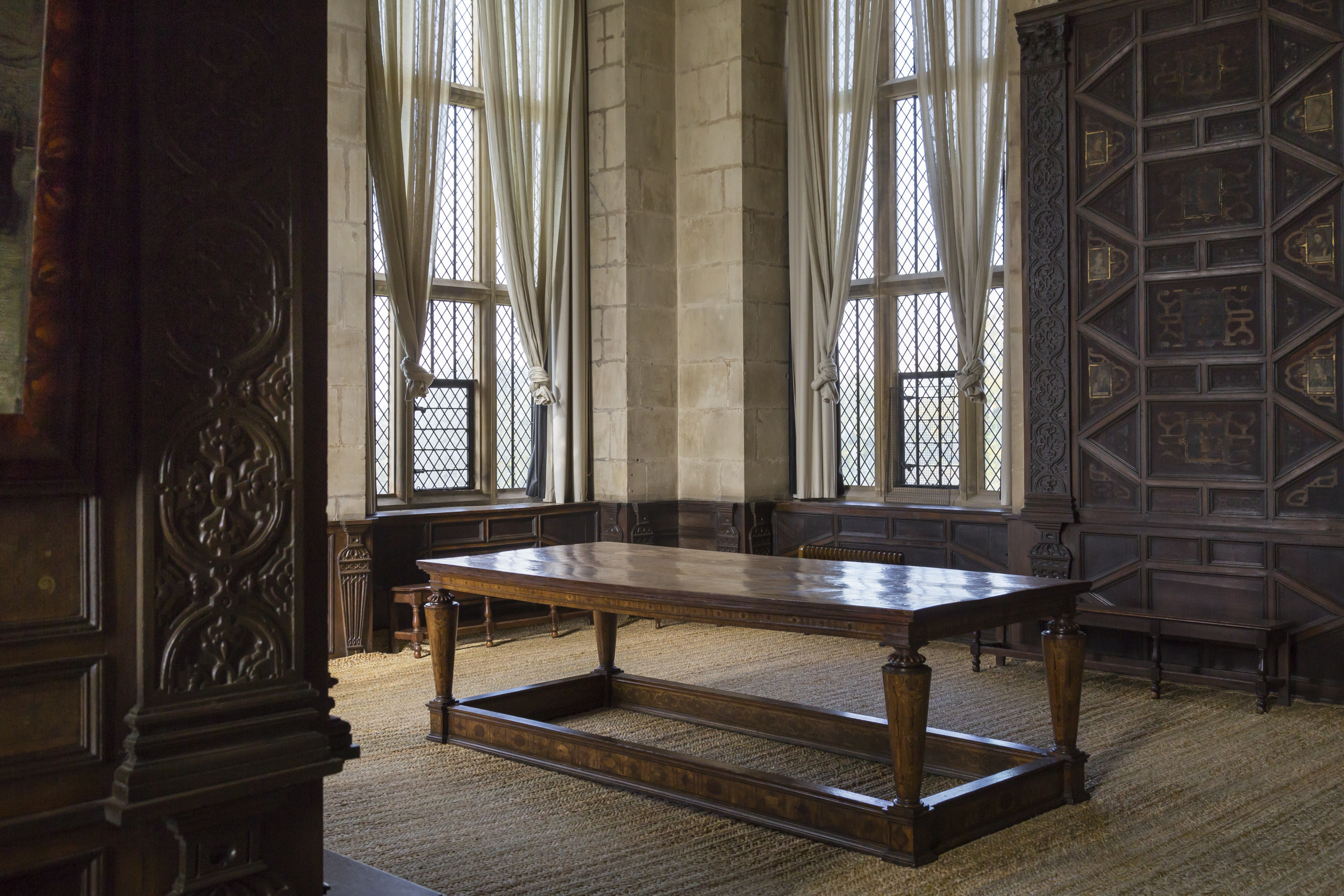 Furniture and panelled walls in the High Great Chamber, Hardwick Hall, Derbyshire.