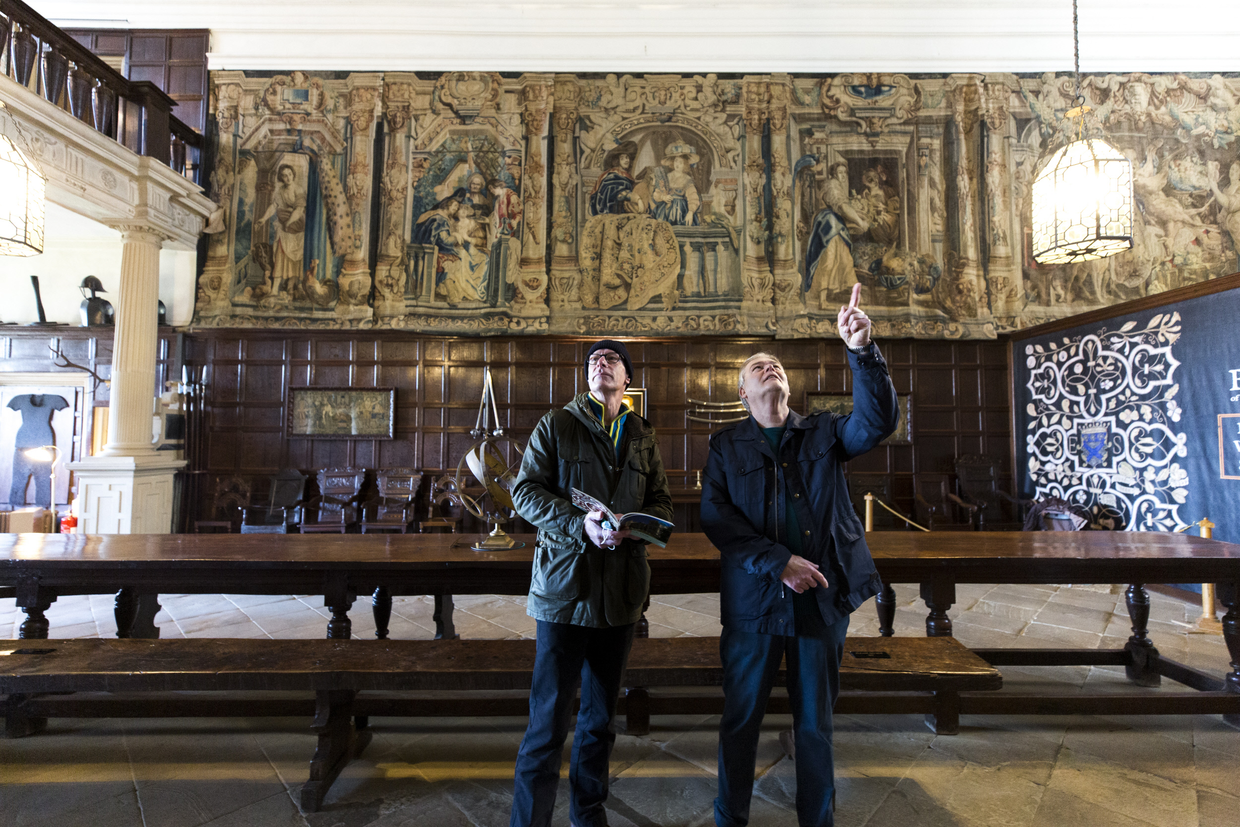 Visitors exploring the Entrance Hall interior at Hardwick, Derbyshire